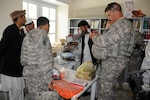 Army 1st Lt. Rodney Robinson, agri-business marketing specialist from the Texas National Guard, inventories the items that the Texas Agribusiness Development Team funded for Sanayee High School. Included were tools and seeds for the agricultural classes that 10th and 11th grade students attend.