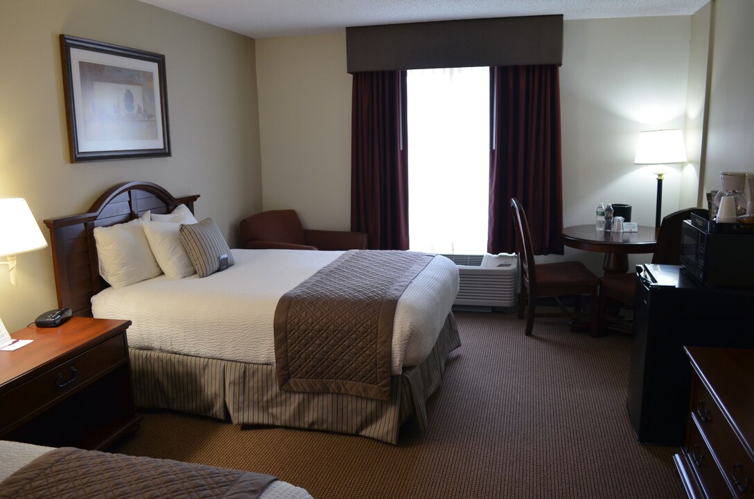 A recently renovated efficiency room at the Crossroads Inn aboard Marine Corps Base Quantico features new carpet, paint, furniture, curtains, artwork and bedding in an updated color scheme and design.