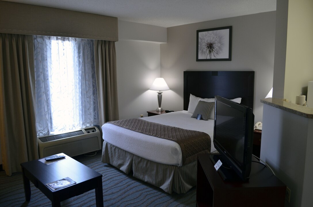 A recently renovated efficiency room at the Crossroads Inn aboard Marine Corps Base Quantico features new carpet, paint, furniture, curtains, artwork and bedding in an updated color scheme and design.