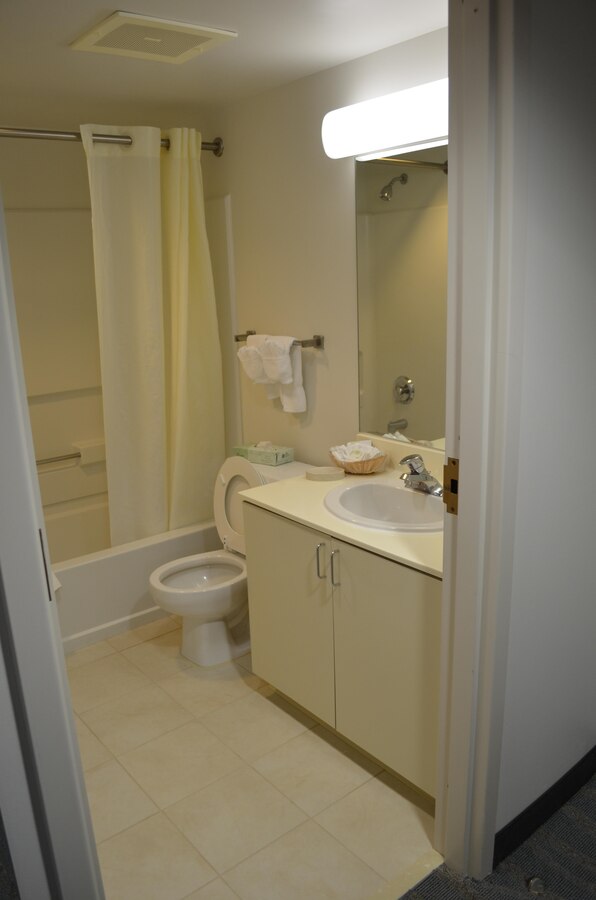 A recently renovated efficiency room at the Crossroads Inn aboard Marine Corps Base Quantico features new carpet, paint, furniture, curtains, artwork and bedding in an updated color scheme and design.