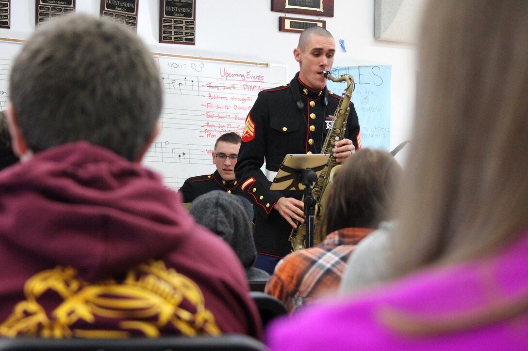 SAN DIEGO - Sgt. Tyler Van Dam, a saxophonist and a Moore Park, Calif., native, performs at Point Loma High School Jan. 27 in San Diego during a Marine Band San Diego jazz combo high school tour Jan. 26 through 30. The musical combo is touring high schools throughout Marne Corps Recruiting Station San Diego’s area of operation and teaching students about Marine Corps musician enlistment opportunities. Each performance lasts approximately two hours and encompasses a variety of song styles including original pieces by the musicians. (U.S. Marine Corps photo by Sgt. Erica Kirsop/Released)