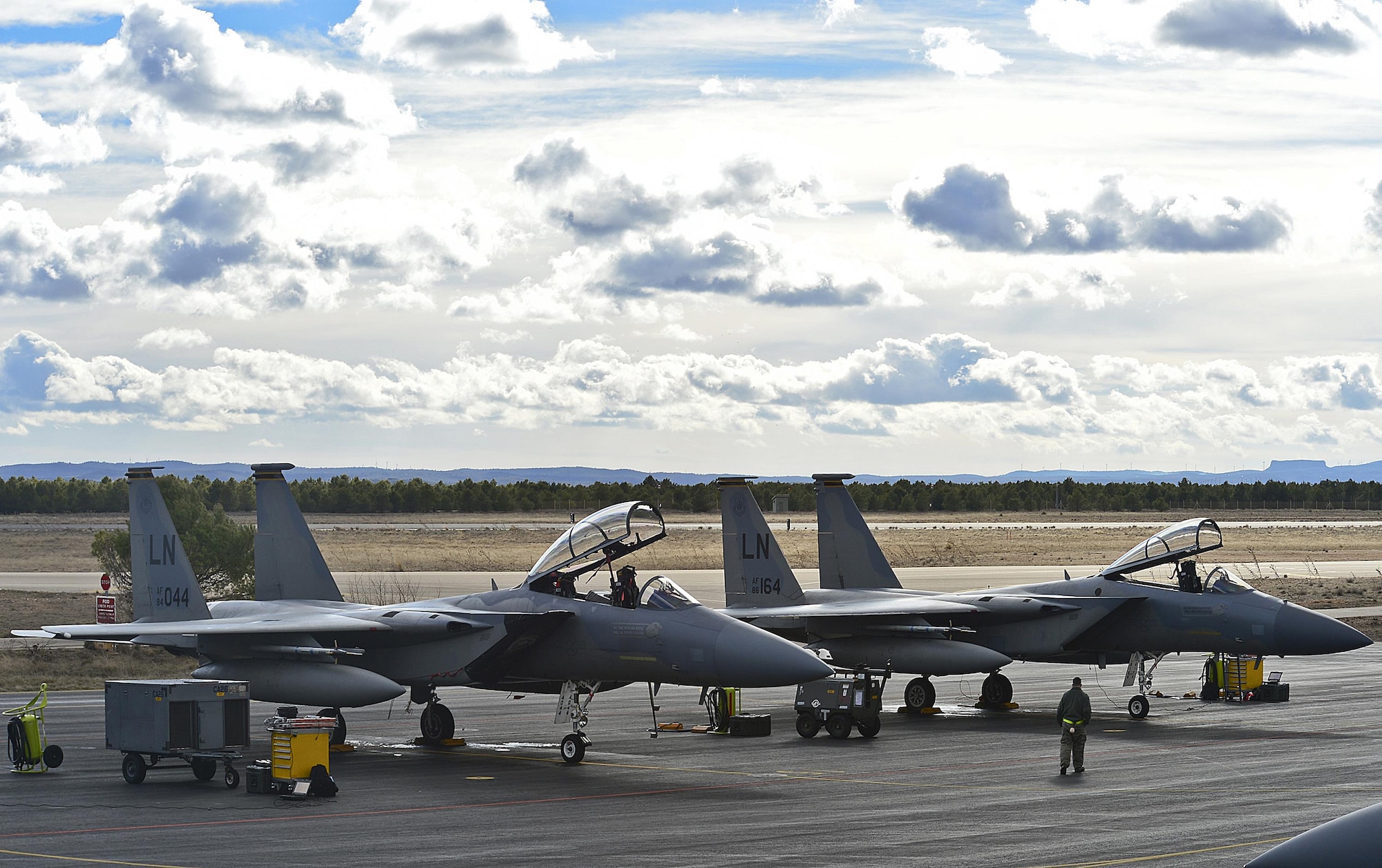 Two F-15C Eagles from the 493rd Fighter Squadron are checked prior to takeoff during the Tactical Leadership Program Jan. 20, 2014, at Albacete Air Base, Spain. The 493rd FS from Royal Air Force Lakenheath, England, participated in the multi-national program, which develops key leadership and mission-planning skills needed for NATO operations. Members of the 493rd FS are recipients of the 2014 Raytheon Trophy, being recognized as the top fighter squadron in the Air Force. (U.S. Air Force photo/Staff Sgt. Stephanie Mancha)