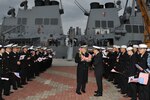 BUSAN, Republic of Korea (Jan. 29, 2015) - Cmdr. Chase Sargeant, commanding officer of the Arleigh Burke-class guided-missile destroyer USS John S. McCain (DDG 56), is greeted by a Republic of Korea naval officer after the ship arrived in Busan for a scheduled port visit. John S. McCain just concluded a series of bilateral training exercise with the Republic of Korea navy in international waters west of the Korean peninsula. The routine exercise focused on reinforcing teamwork and interoperability between the U.S. and Republic of Korea navies while giving Sailors the opportunity to sharpen their tactical skills. 