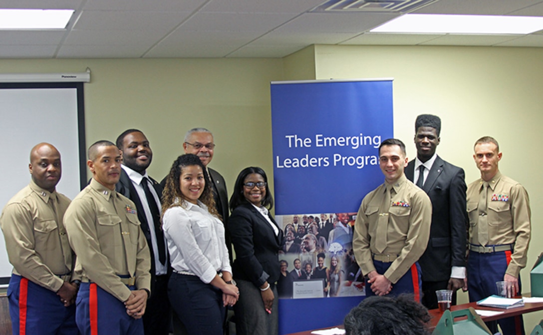 Members of the Gloucester Institutes Emerging Leaders Program pose with instructors and staff members of the Marine Corps Leadership Seminar and the guest speaker, retired Marine Corps Brig. Gen. George Walls, Jr., during the Marine Corps Leadership Seminar held at the Gloucester Institute in Virginia, Jan. 24, 2015. The seminar teaches Marine Corps leadership principles to college students, in an effort to foster a positive image of the Marine Corps and to prepare the nation’s future leaders by imparting values and lessons learned over the Corps’ long and illustrious history. (U.S. Marine Corps photo by Sgt. Aaron Diamant/released)