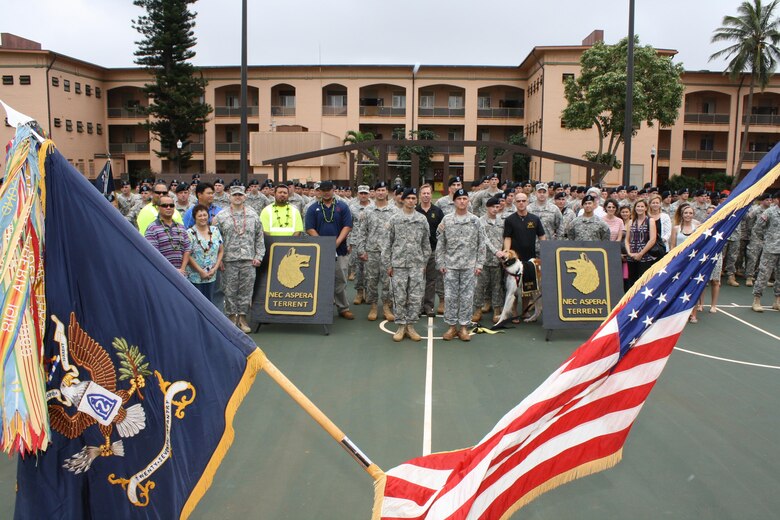 SCHOFIELD BARRACKS, Hawaii - Honolulu District officials and the 2nd Battalion, 27th Infantry Regiment “Wolfhounds” gathered in the center of historic Quad D at Schofield Barracks Jan. 23 for a ribbon cutting ceremony which officially reopened two barracks renovated by the Corps. 
Wolfhounds Commander Lt. Col. Kevin Williams hosted the ceremony and honored the District engineers and contractor representatives for completing the renovation of buildings 450 and 451. The $4.73 million Corps of Engineers project involved renovating the buildings to meet current Unaccompanied Enlisted Personnel Housing 1+1 living standards. Quad D opened in 1921 and is part of the Schofield Barracks Historic District. The Corps’ renovation work required meeting historic preservation standards.  