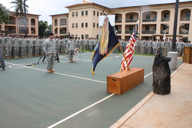 SCHOFIELD BARRACKS, Hawaii - Honolulu District officials and the 2nd Battalion, 27th Infantry Regiment “Wolfhounds” gathered in the center of historic Quad D at Schofield Barracks Jan. 23 for a ribbon cutting ceremony which officially reopened two barracks renovated by the Corps. 
Wolfhounds Commander Lt. Col. Kevin Williams hosted the ceremony and honored the District engineers and contractor representatives for completing the renovation of buildings 450 and 451. The $4.73 million Corps of Engineers project involved renovating the buildings to meet current Unaccompanied Enlisted Personnel Housing 1+1 living standards. Quad D opened in 1921 and is part of the Schofield Barracks Historic District. The Corps’ renovation work required meeting historic preservation standards.  