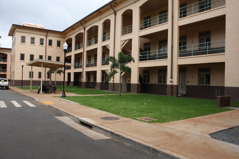 SCHOFIELD BARRACKS, Hawaii - Honolulu District officials and the 2nd Battalion, 27th Infantry Regiment “Wolfhounds” gathered in the center of historic Quad D at Schofield Barracks Jan. 23 for a ribbon cutting ceremony which officially reopened two barracks renovated by the Corps. 
The $4.73 million Corps of Engineers project involved renovating the buildings to meet current Unaccompanied Enlisted Personnel Housing 1+1 living standards. Quad D opened in 1921 and is part of the Schofield Barracks Historic District. The Corps’ renovation work required meeting historic preservation standards.  