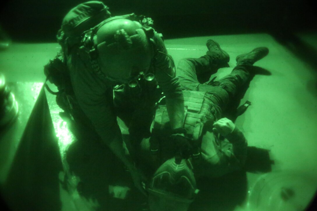 A Critical Skills Operator with Bravo Company, 1st Marine Special Operations Battalion, U.S. Marine Corps Forces, Special Operations Command, performs first aid on a simulated casualty during Visit, Board, Search and Seizure training near Naval Base Coronado, Calif., Jan. 15. (Official Marine Corps photo by Sgt. Donovan Lee/released)