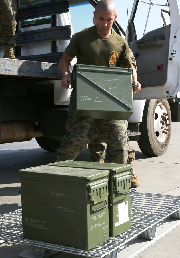 Sgt. Larry P. Guerrero, a quality assurance safety officer with Headquarters and Headquarters Squadron, moves ammunition from a truck aboard Marine Corps Air Station Miramar, Calif., Jan. 21. Station ordnance Marines handle the storage of ordnance before it is issued to any squadron.
