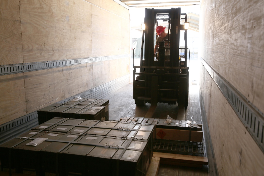 Lance Cpl. Corbin McGrath, an aviation ordnance system technician with Headquarters and Headquarters Squadron, moves a pallet of ammunition from a delivery truck aboard Marine Corps Air Station Miramar, Calif., Jan. 21. Ordnance Marines handle the job of issuing off all of the ordnance used throughout the air station.
