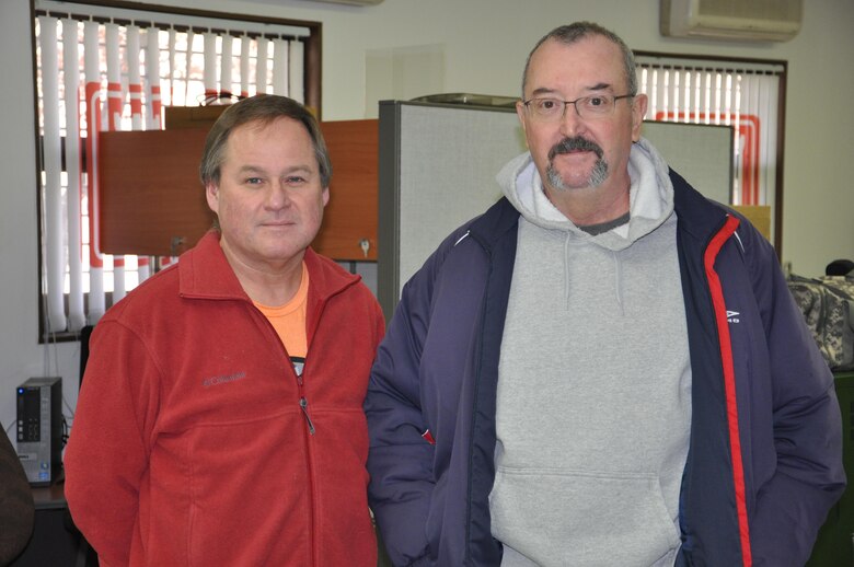 Bob Lamoreaux (left) and Jerry Giefer pose for a picture inside the operations office on the Far East District compound Jan. 23. Lamoreaux provided life saving cardio-pulmonary resuscitation after Giefer suffered a heart attack Dec. 30.