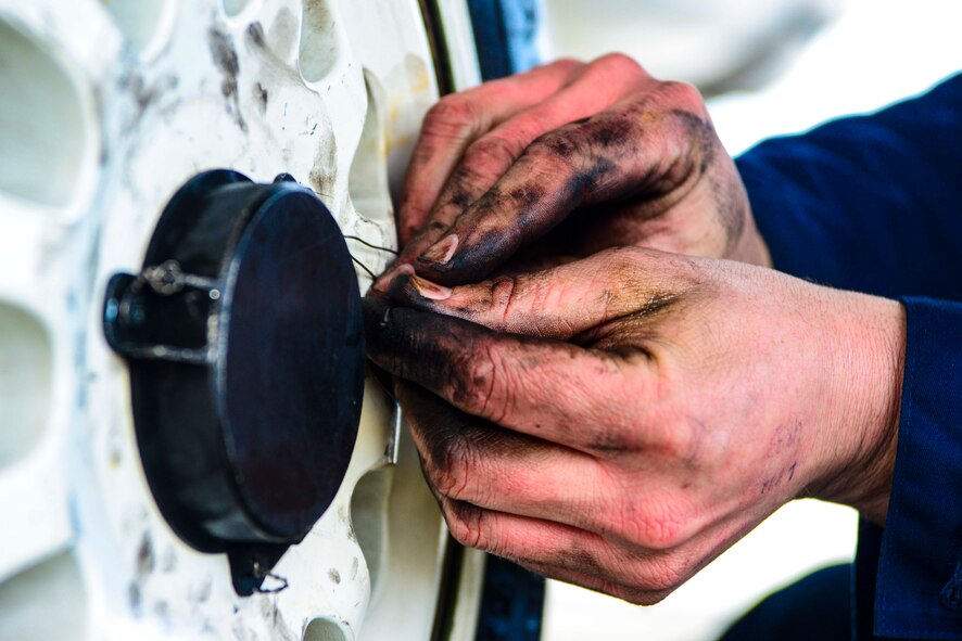 Staff Sgt. James McFadden, 35th Aircraft Maintenance Squadron dedicated crew chief, secures wire bracing on the tire of an F-16 Fighting Falcon on Jan. 8, 2015, at Misawa Air Base, Japan. Crew chiefs are the last to touch a jet when it takes off and the first to touch it when it lands. (U.S. Air Force photo by Staff Sgt. Derek VanHorn)