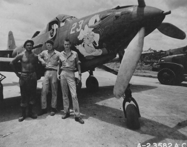On February 6, 1943, 1st Lt William F. McDonough scored two aerial victories, contributing to the 40th Fighter Squadron and 35th Fighter Group's record for the highest number of aerial victories scored in a single day.  Pictured here, McDonough stands with his aircrew by his P-39 Airacobra.  (U.S. Air Force historical photo/Released)