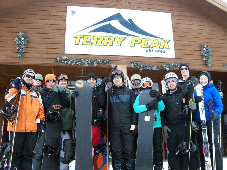 Airmen take a group photo during a Single Airman Initiative ski trip at Terry Peak, S.D., Jan. 25, 2015.  These trips are free for single Airmen, enlisted or officer, and give them a chance to meet new people while taking advantage of the recreational opportunities the Black Hills has to offer. (U.S. Air Force courtesy photo/Released)