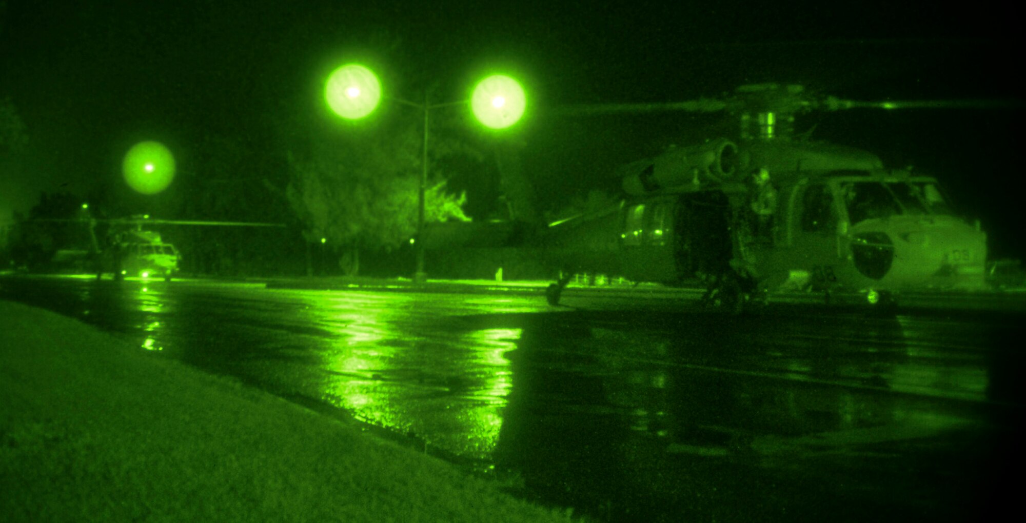 Two MH-60S Knighthawks from Navy’s Helicopter Sea Combat Squadron-25 lands on Marine Corps Drive during a Realistic Urban Training Exercise Jan. 15, 2015, in Hagatna, Guam.  The 31st Marine Expeditionary Unit practiced skills such as fast roping insertion, live sniper firing and hard hits in convoys as part of pre-deployment training. (U.S. Air Force photo by Staff Sgt. Robert Hicks/Released)