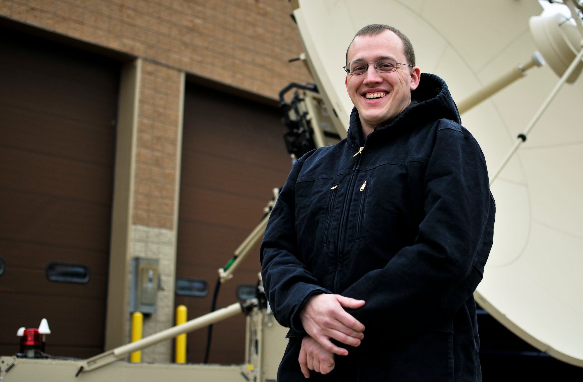 U.S. Air Force Tech. Sgt. Benjamin M. Springsteen, a cyber transport systems specialist with the 264th Combat Communications Squadron, visits his home unit in Peoria, Ill., Dec. 9, 2014, after returning from a deployment to Monrovia, Liberia, in support of Operation United Assistance. Springsteen, currently augmenting the Joint Communications Support Element at MacDill Air Force Base, Fla., was responsible for helping build the communications capabilities for military units mitigating the Ebola virus outbreak in the country. (U.S. Air National Guard photo by Staff Sgt. Lealan Buehrer/Released)