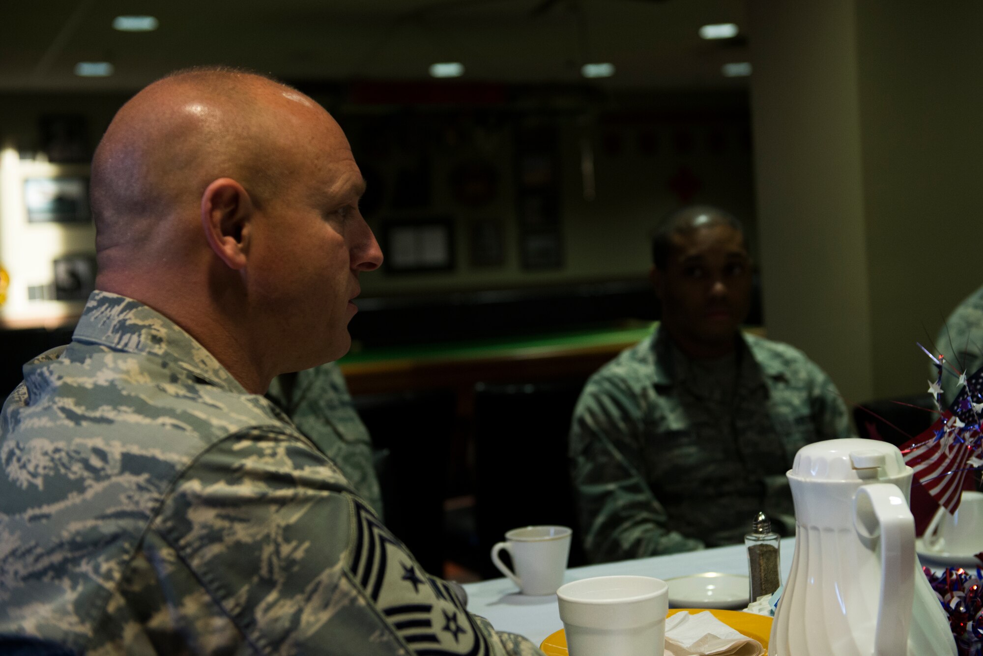 U.S. Air Force Chief Master Sgt. Scott Fuller, Ninth Air Force command chief, speaks with Moody Airmen during breakfast Jan. 29, 2015. Fuller spoke about upcoming changes to the Enlisted Performance Report system and the importance of retirement investments. (U.S. Air Force photo by Airman 1st Class Dillian Bamman/Released)