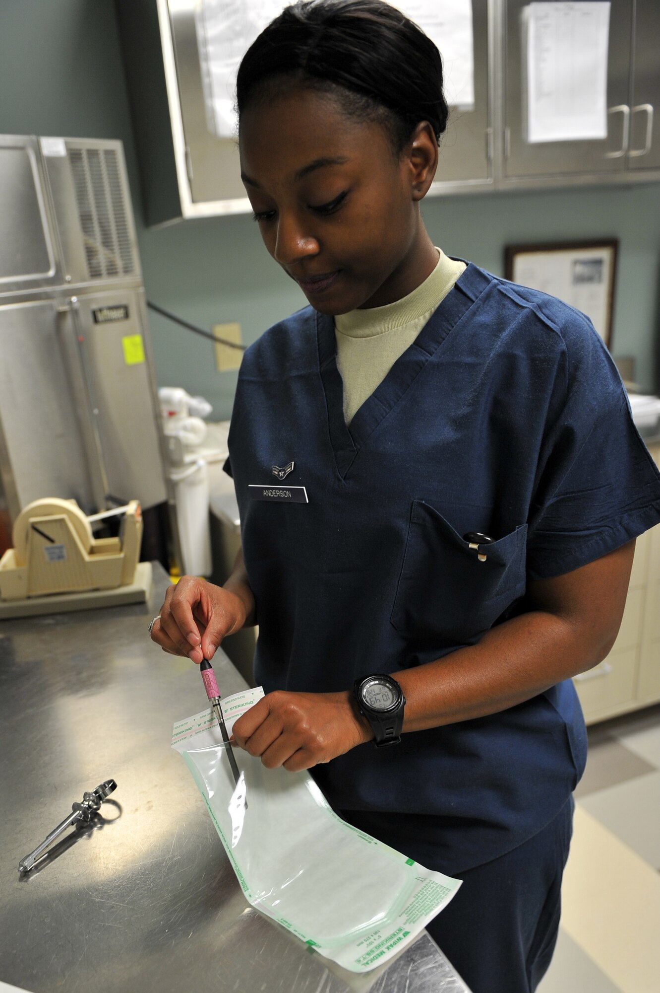 ALTUS AIR FORCE BASE, Okla. – U.S. Air Force Airman 1st Class Vinecia Anderson, 97th Medical Group prophylaxis assistant, places a clean dental instrument into a sterilized package inside the Dental Clinic Jan. 28, 2015. All of the used dental instruments must be cleaned, sanitized, dried, packaged, sterilized and checked before they can be used again to ensure there is not bacteria present. (U.S. Air Force photo by Senior Airman Dillon Davis/Released)