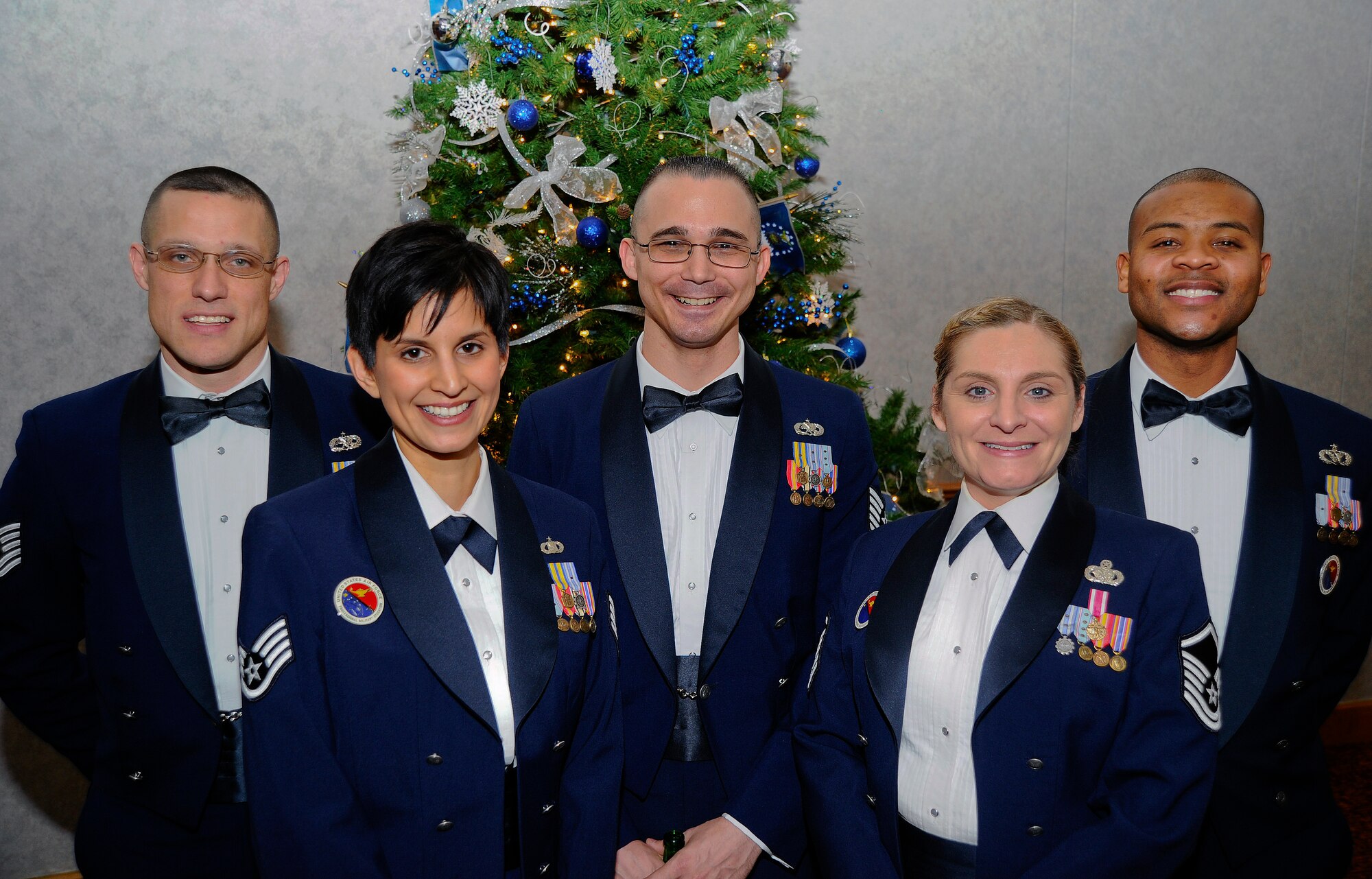 The 22nd Force Support Squadron Airman Leadership School instructors pose during an ALS graduation Dec. 18, 2014, at McConnell Air Force Base, Kan. The instructors of ALS teach a flight of 12 to 13 senior airmen and provide them with the tools necessary to become capable supervisors and non-commissioned officers. (U.S. Air Force photo/Senior Airman Victor J. Caputo)