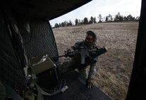 Airman 1st Class Jordan Gilliand, 341st Security Forces Group Tactical Response Force member, climbs on board a UH-1N Huey Jan. 27, 2015, near Malmstrom Air Force Base, Mont. Gilliand provided security during the flight, aiding in the sweeping and securing of launch facilities. (U.S. Air Force photo/ Airman 1st Class Dillon Johnston)