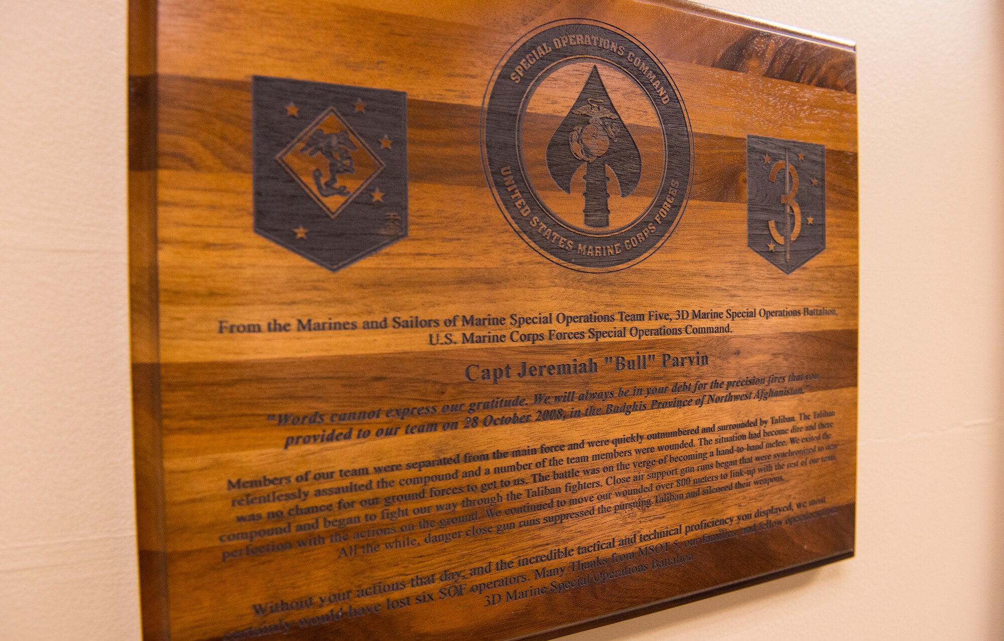 A plaque from a Marine Special Operations Team rests in the office of U.S. Air Force Maj. Jeremiah ‘Bull’ Parvin, 75th Fighter Squadron director of operations, Jan. 28, 2015, at Moody Air Force Base, Ga. The team presented Parvin with the plaque to thank him for his bravery and heroic actions during a 2008 deployment to Afghanistan. (U.S. Air Force photo by Airman 1st Class Ceaira Tinsley/Released)