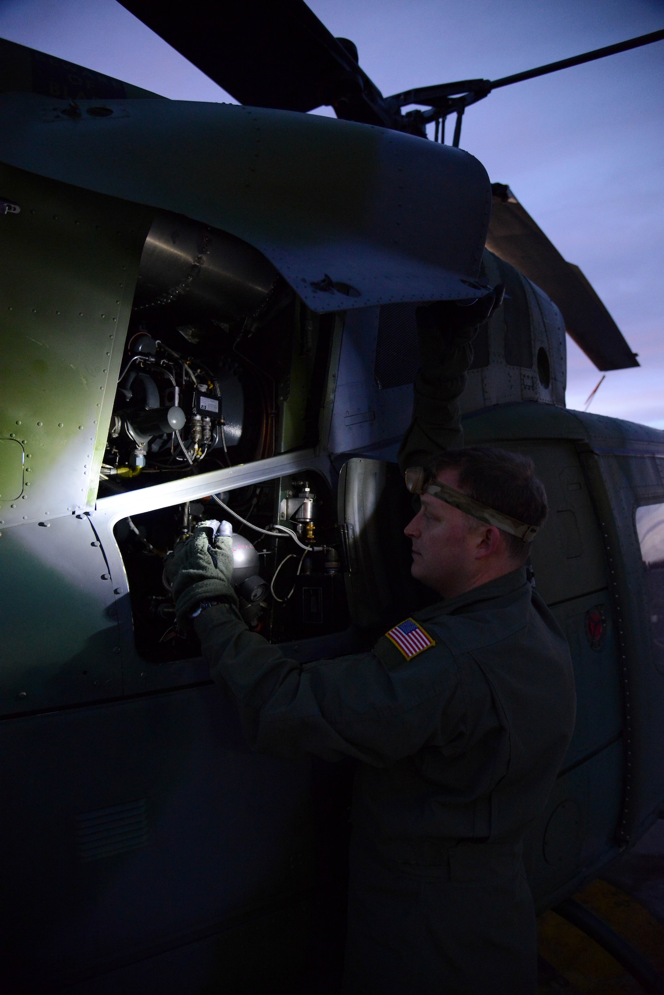 Staff Sgt. Ryan Oliver, 40th Helicopter Squadron special missions aviator, performs a preflight inspection on a UH-1N Huey Jan. 27, 2015 at Malmstrom Air Force Base, Mont. Inspections are performed before and after a flight to make sure there are no life-threatening defects on the aircraft. (U.S. Air Force photo/ Airman 1st Class Dillon Johnston)