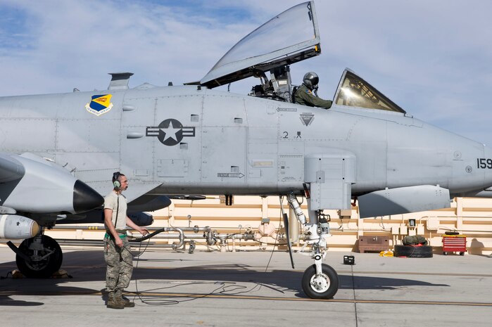 Senior Airman Charles Nicholls, a crew chief assigned to the 355th Aircraft Maintenance Squadron, Davis-Monthan Air Force Base, Ariz., performs pre-flight inspections on an A-10 Thunderbolt II during Green Flag-West 15-03 at Nellis Air Force Base, Nev., Jan. 26, 2015. Specifically designed for close air support, its combination of large and varied ordnance load, long loiter time, accurate weapons delivery, austere field capability, and survivability has proven invaluable to the United States and its allies. (U.S. Air Force photo by Airman 1st Class Mikaley Towle)