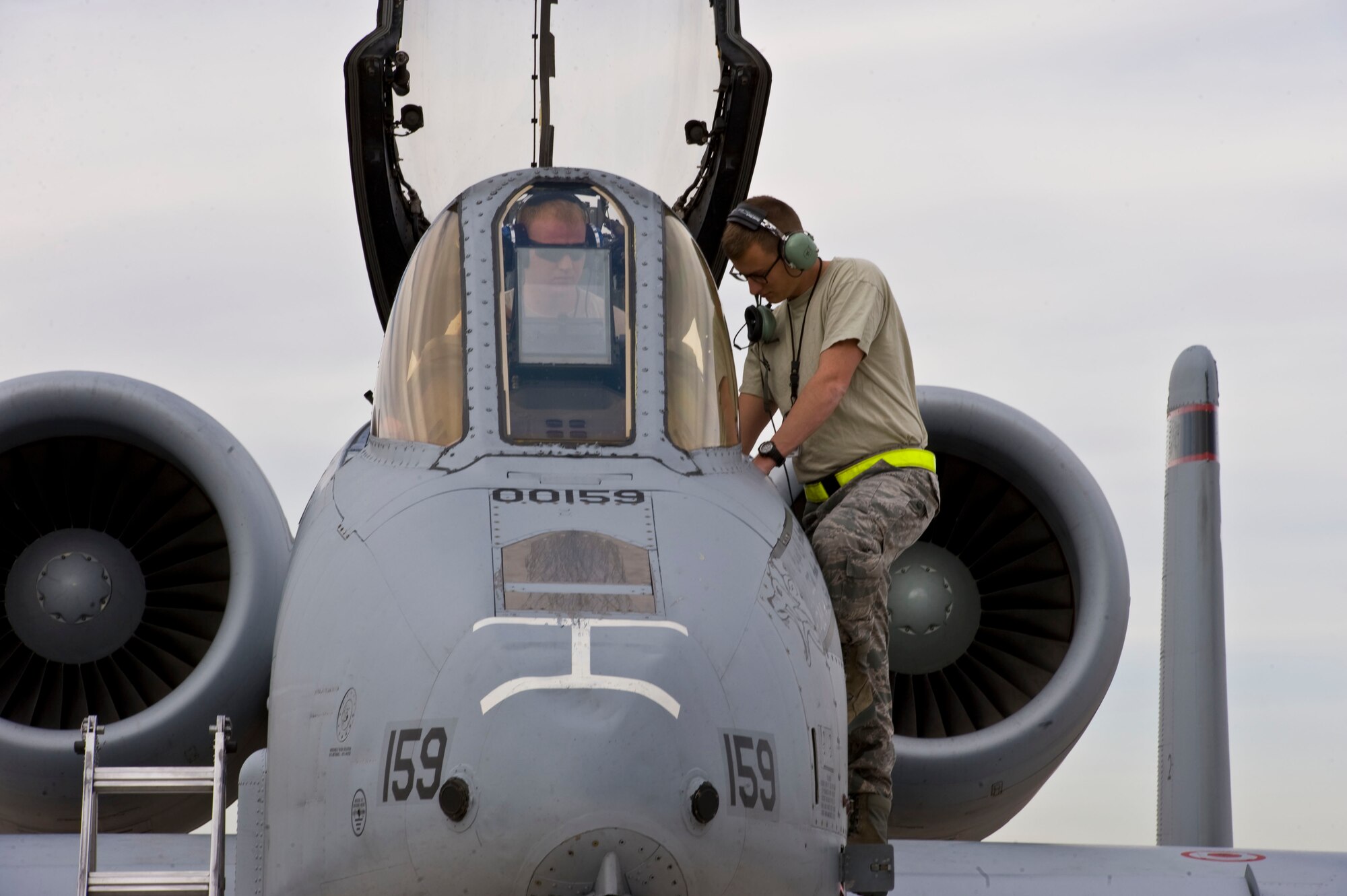 Crew chiefs assigned to the 355th Aircraft Maintenance Squadron, Davis-Monthan Air Force Base, Ariz., perform pre-flight inspections on an A-10 Thunderbolt II during Green Flag-West 15-03 at Nellis Air Force Base, Nev., Jan. 26, 2015. Pre-flight inspections are done before each flight to help ensure pilot safety. (U.S. Air Force photo by Airman 1st Class Mikaley Towle)