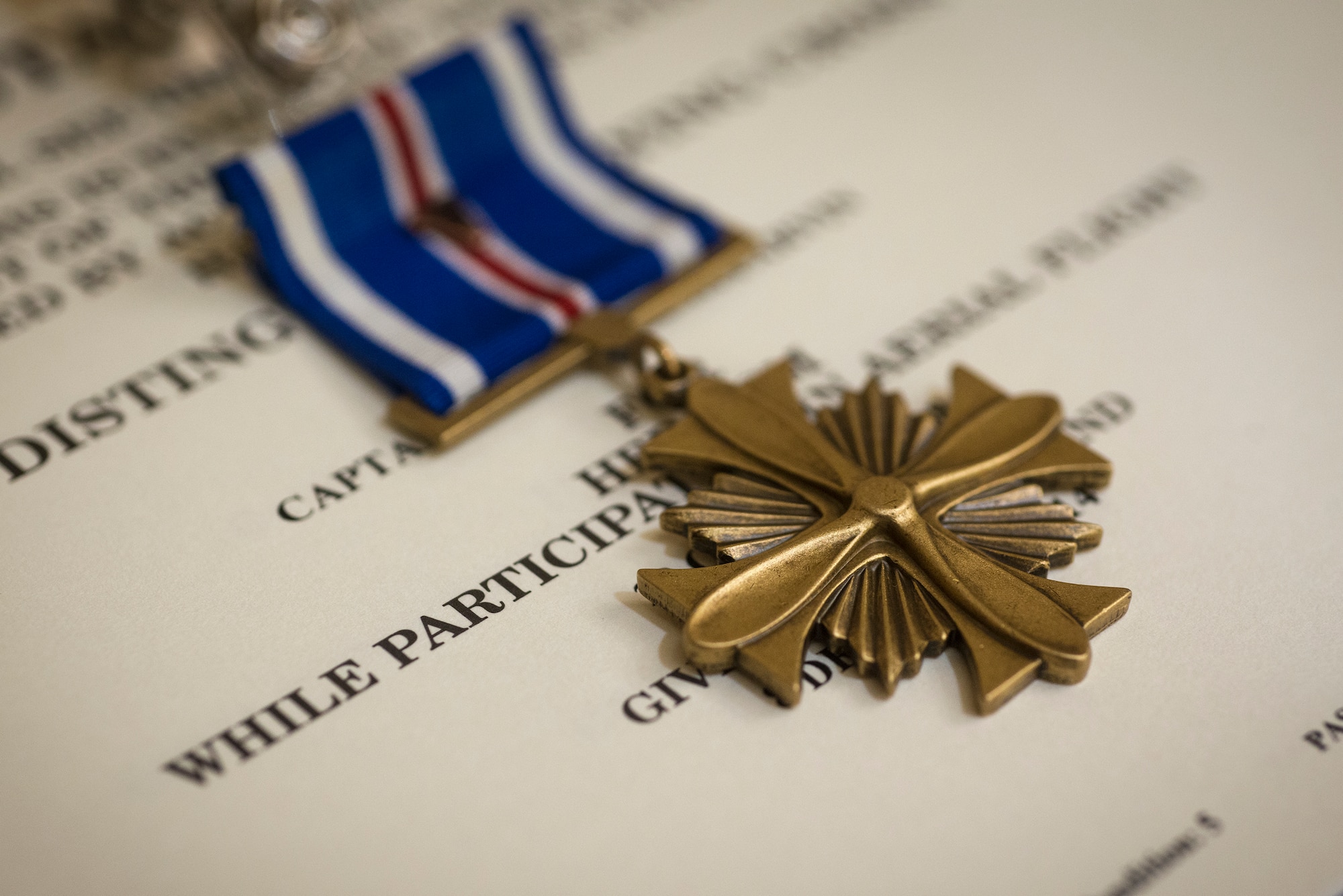 A Distinguished Flying Cross (DFC) sits on display prior to being awarded to U.S. Air Force Maj. Jeremiah Parvin, 75th Fighter Squadron A-10 C Thunderbolt II pilot, Jan. 29, 2015, at Moody Air Force Base, Ga. The DFC is awarded for heroism or extraordinary achievement while participating in an aerial flight. (U.S. Air Force photo by Senior Airman Ryan Callaghan/Released)