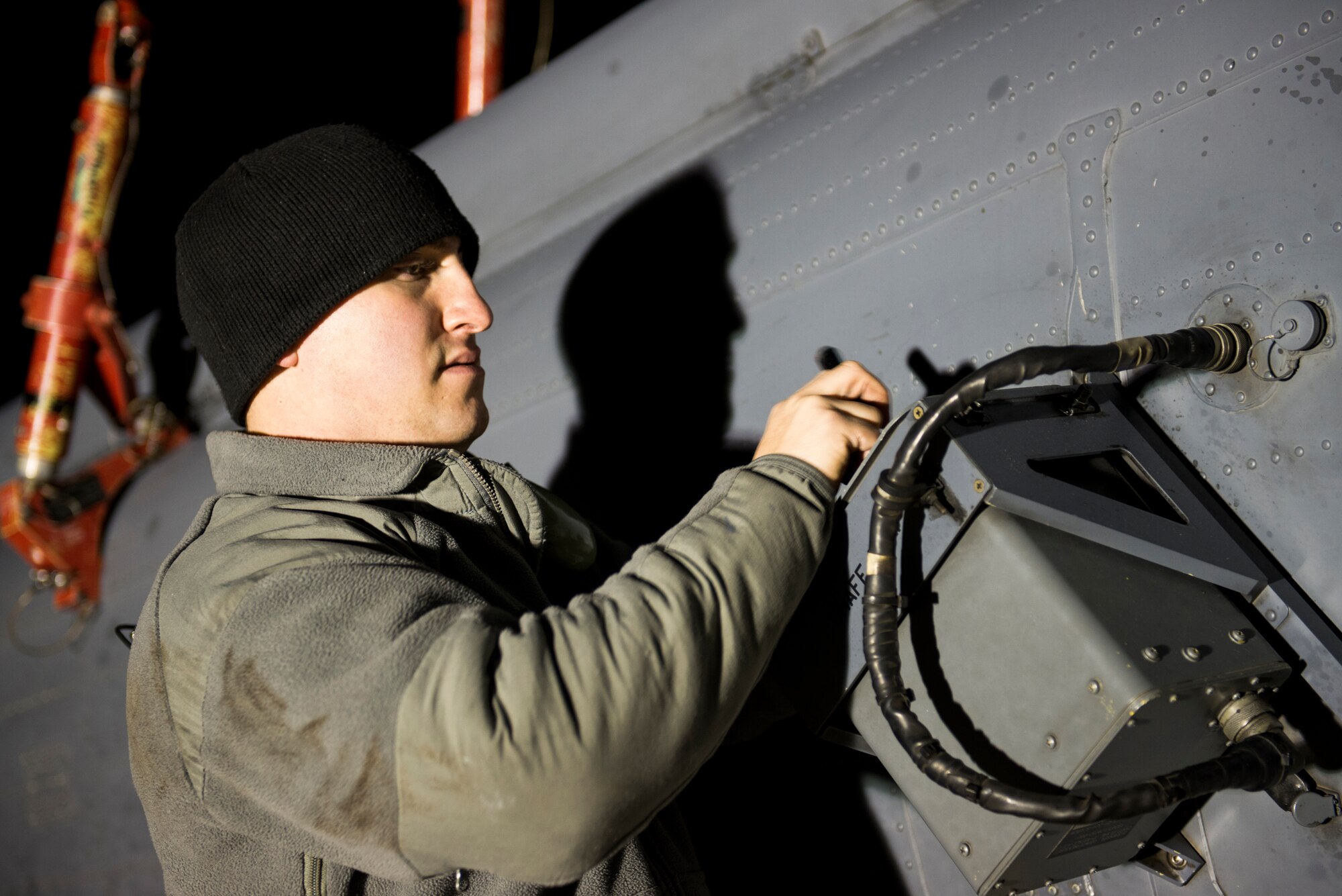 U.S. Air Force Senior Airman Lance Chunn, 723d Aircraft Maintenance Squadron , makes adjustments to a chaff dispenser on an HH-60G Pave Hawk during a short-notice deployment exercise Jan. 28, 2015, at Moody Air Force Base, Ga. The 723d AMXS conducted extensive inspections on the aircraft in order to prepare the HH-60 for loading. (U.S. Air Force photo by Airman 1st Class Dillian Bamman/Released)