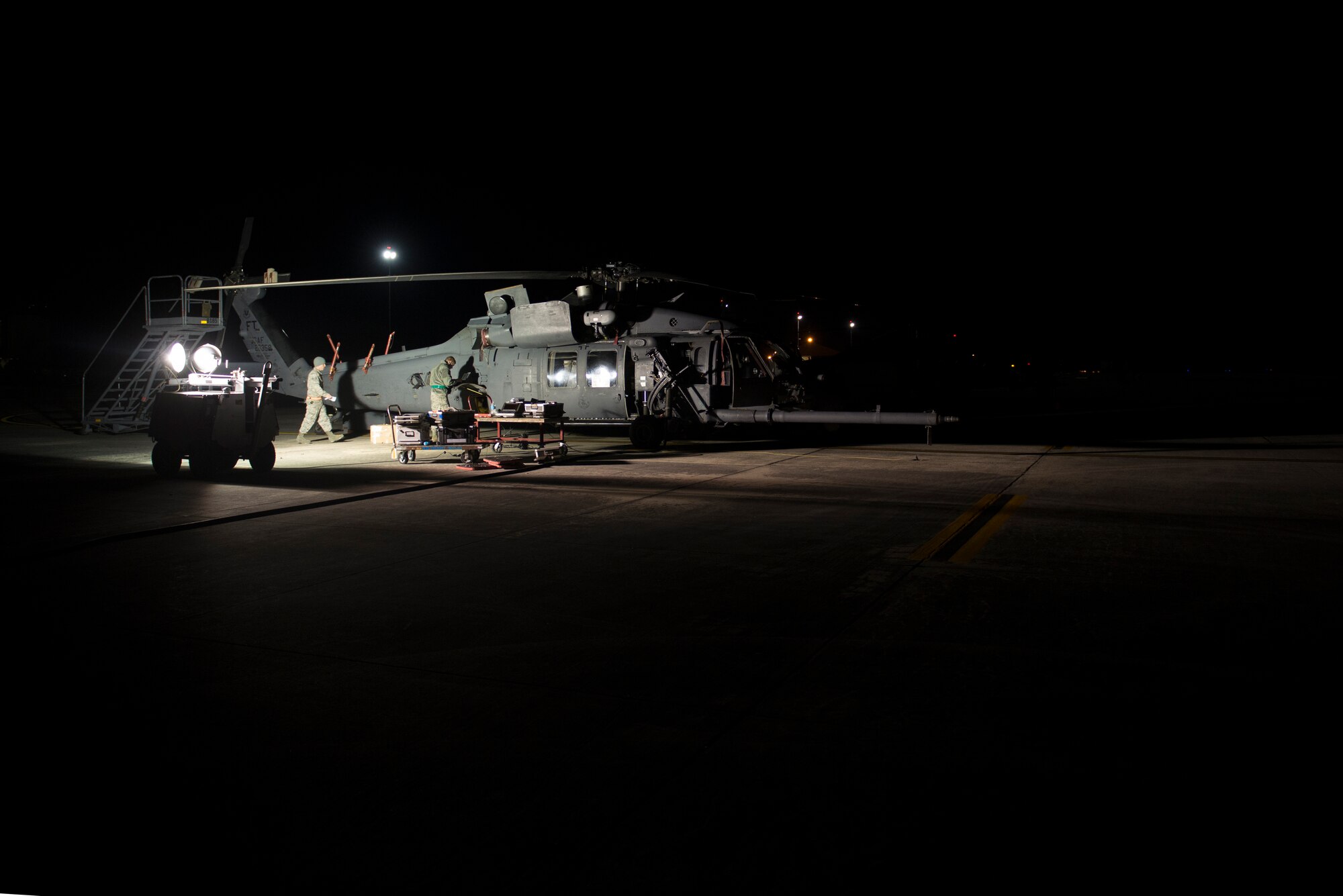 Airmen from the 723d Aircraft Maintenance Squadron prepare an HH-60G Pave Hawk for a short-notice deployment exercise Jan. 28, 2015, at Moody Air Force Base, Ga.  In addition to the 723d AMXS, the 38th and 41st Rescue Squadrons participated in the exercising as well. (U.S. Air Force photo by Airman 1st Class Dillian Bamman/Released)
