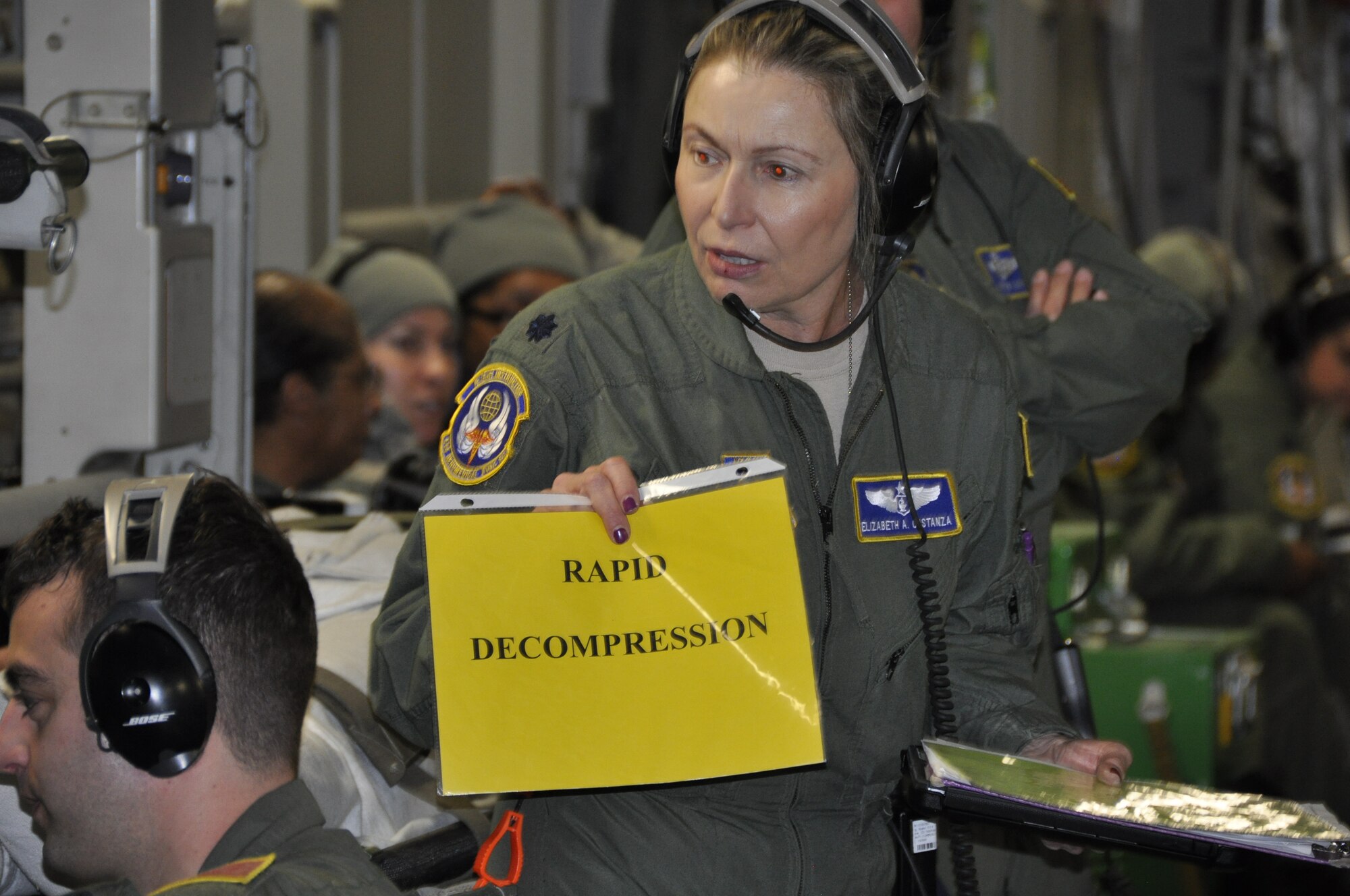 Lt. Col. Elizabeth Costanza displays the next scenario the medical team must demonstrate their knowledge in handling (Air Force photo/Master Sgt. Donna T. Jeffries)