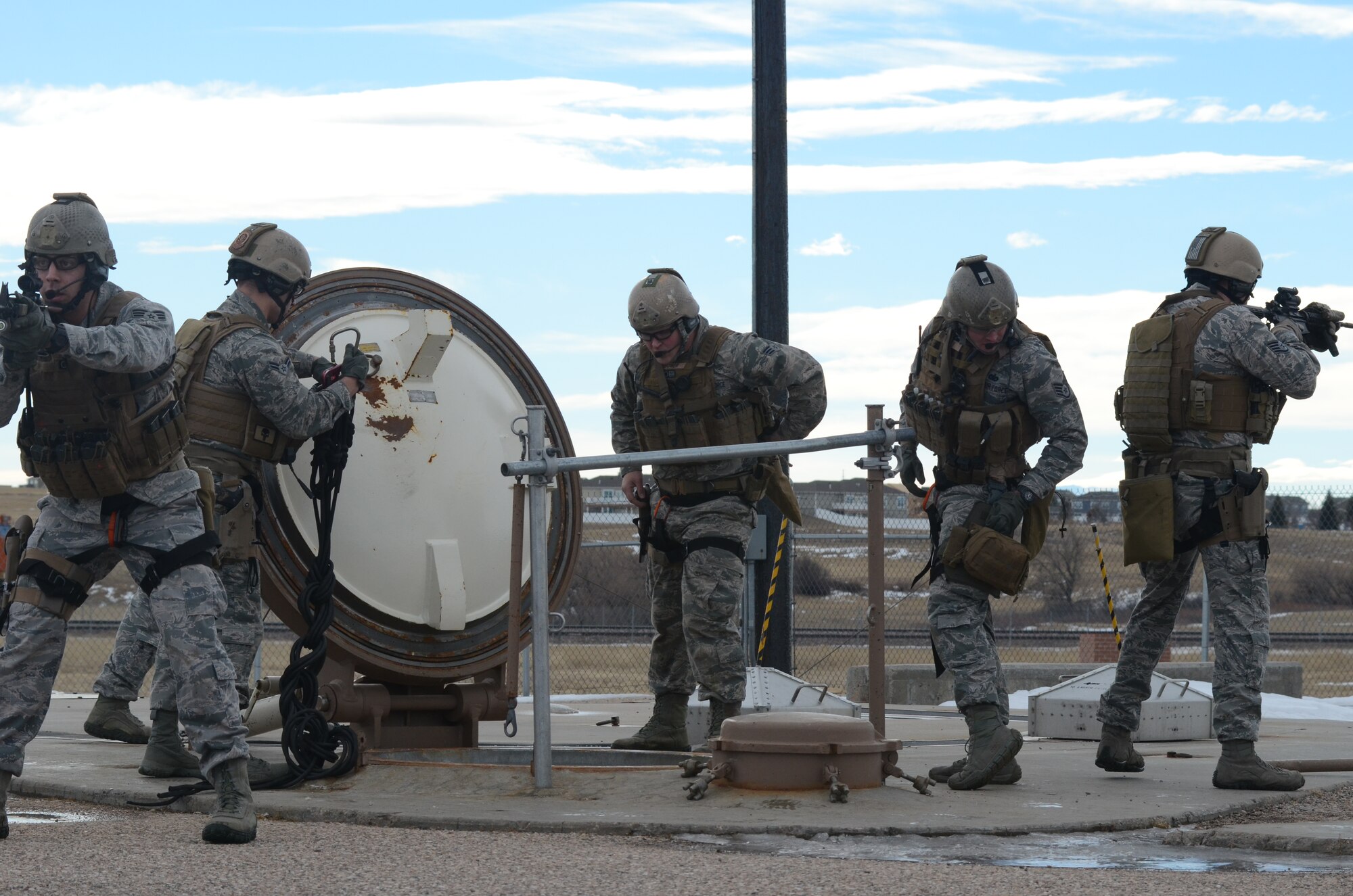 Airmen in the 90th Security Forces Group, F.E. Warren Air Force Base, Wyo., demonstrate tactical response maneuvers to visiting Academy cadets Jan. 16, 2015. The cadets visited F.E. Warren in order to immerse themselves in their future careers in the missile operations career field. (U.S. Air Force photo/Senior Airman Veronica Ward)