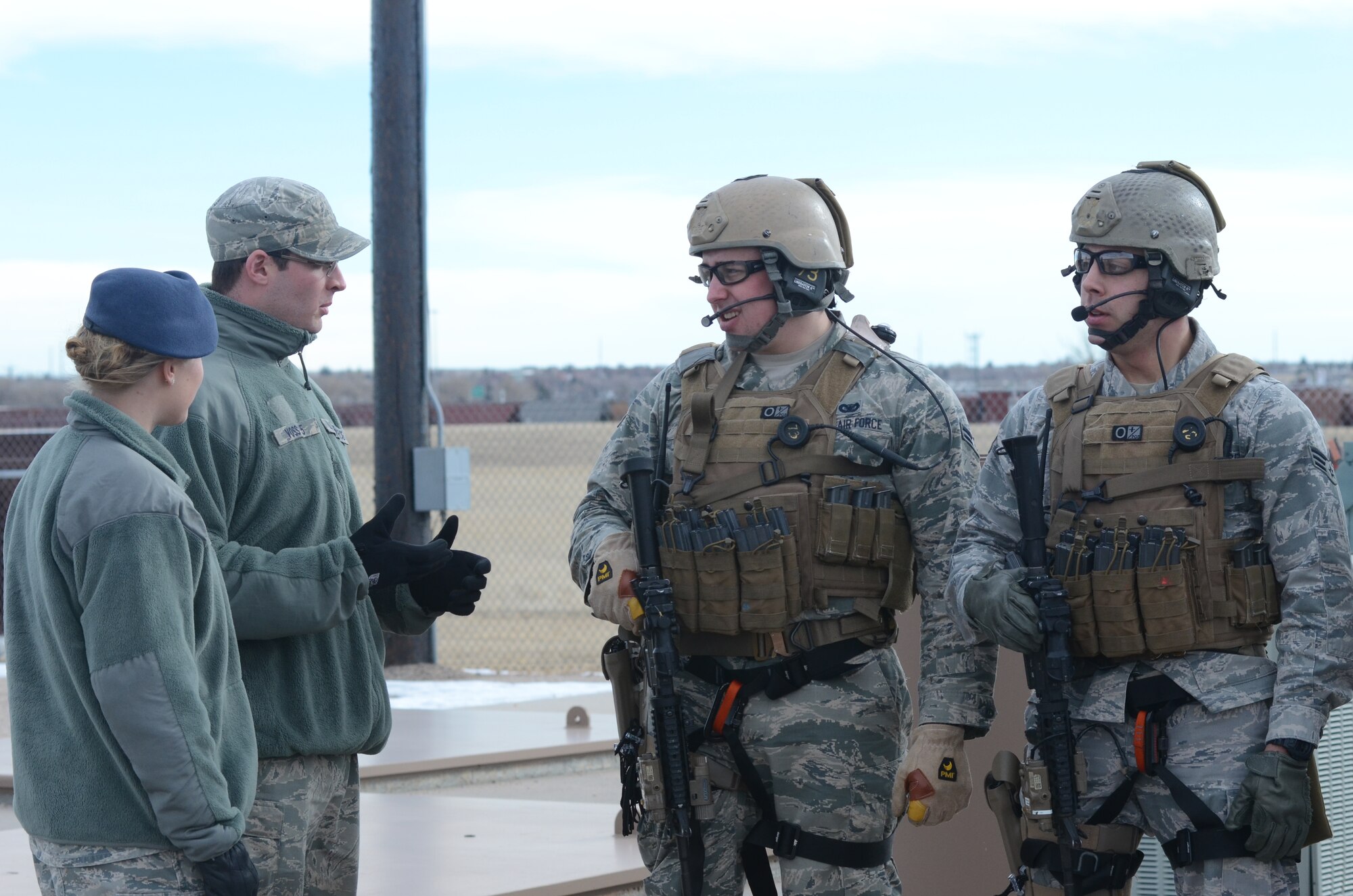 Cadets watch a demonstration by tactical response forces at F.E. Warren Air Force Base, Wyo., Jan. 16, 2015. The cadets visited F.E. Warren in order to immerse themselves in their future careers in the missile operations career field. (U.S. Air Force photo/Senior Airman Veronica Ward)
