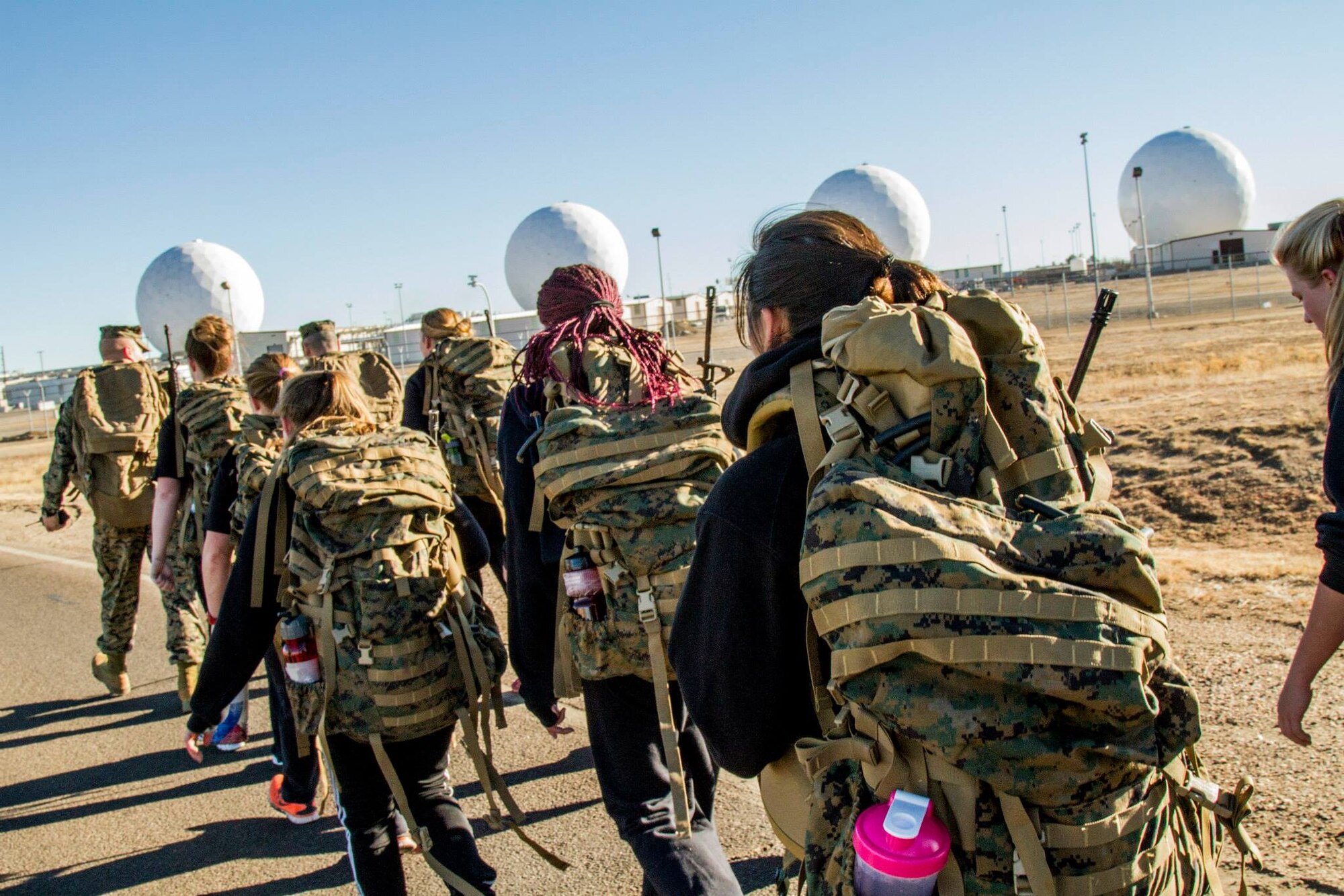 U.S. Marine Corps poolees endure a three-mile hike around Buckley with ruck sacks before heading over to the fitness center for a strengthening workout Jan. 15, 2014, on Buckley Air Force Base, Colo. Poolees are members of the delayed entry program that have not yet shipped out to recruit training. The DEP workouts enable poolees to be accustomed to the tough workouts and mental stress they will endure during recruit training. (U.S. Marine Corps photo by Sgt. Daniel Malta/Released)