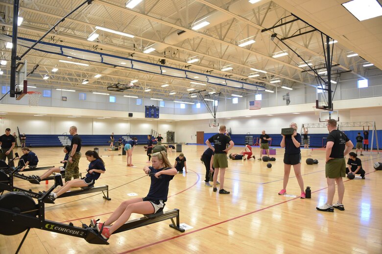 U.S. Marine Corps poolees work out during a delayed entry program all-female workout held Jan. 17, 2015, at the fitness center on Buckley Air Force Base, Colo. Poolees are members of the DEP that have not yet shipped out to recruit training. The DEP workouts are held to enable the poolees to be accustomed to the intense workouts and mental stress they will endure during recruit training. (U.S. Air Force photo by Airman 1st Class Samantha Saulsbury/Released)