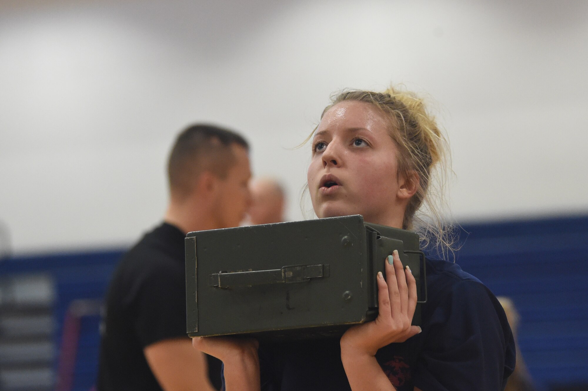 A U.S. Marine Corps poolee lifts an ammunition can during a delayed entry program all-female workout held Jan. 17, 2015, at the fitness center on Buckley Air Force Base, Colo. Poolees are members of the DEP that have not yet shipped out to recruit training. The DEP workouts consist of strengthening exercises such as pull-ups, box jumps, push-ups and squats to enable the poolees to be accustomed to the vigorous workouts and stress they will endure during recruit training. (U.S. Air Force photo by Airman 1st Class Samantha Saulsbury/Released)