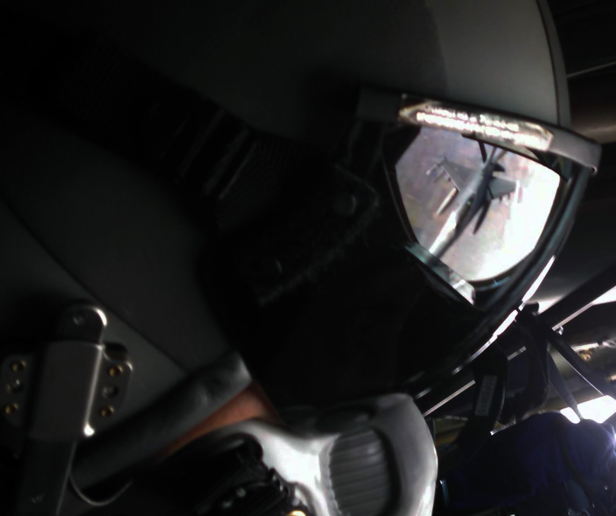 Tech. Sgt. John Bui, a refueling boom operator assigned to the 18th Air Refueling Squadron, 931st Air Refueling Group, McConnell Air Force Base, Kan., peers through his helmet visor while refueling an F-16 Fighting Falcon assigned to the Colorado Air National Guard's 140th Fighter Wing, Jan. 27, 2015. Reservists from the 931st Air Refueling Group operate and maintain the KC-135 Stratotanker in support of Air Mobility Command's worldwide air refueling mission, meeting the air refueling needs of all U.S. Air Force, Navy, Marine, and selected allied nations' aircraft. (U.S. Air Force photo by Senior Airman Sierra Dopfel.)