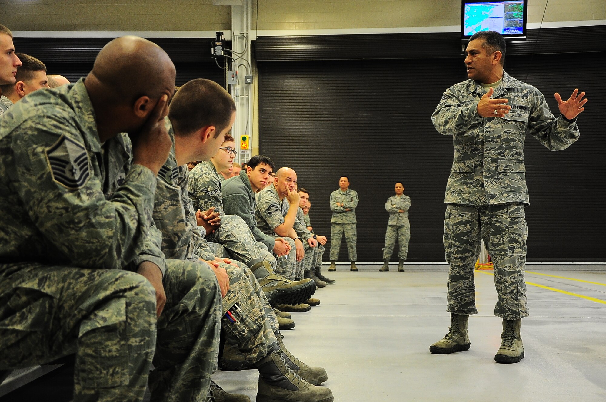 Chief Master Sgt. Gerardo Tapia, Command Chief of Air Education Training Command, briefs Airmen at an enlisted all-call Jan. 23, 2015, at the McAllister Fire Station on Columbus Air Force Base, Miss. Among the topics Tapia spoke about were the new Enlisted Performance Reports, the importance of education to Airmen and promotion eligibility. (U.S. Air Force photo/Airman John Day)