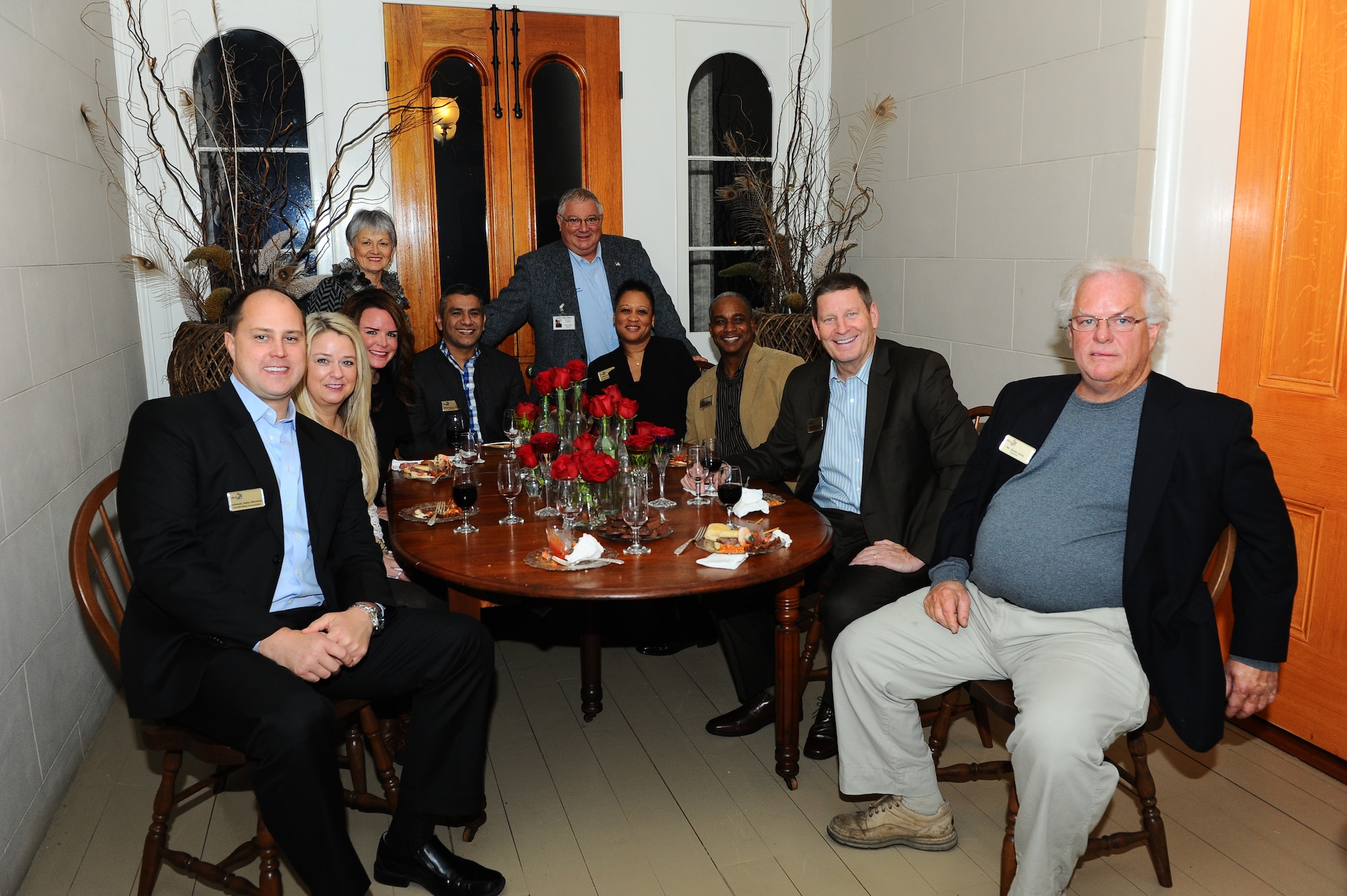Senior leaders from Columbus Air Force Base and the Imes family join Gen. Robin Rand, Commander of Air Education and Training Command, and Chief Master Sgt. Gerardo Tapia, AETC Command Chief, for dinner at a community reception Jan. 22, 2015, held at the Rosedale Antebellum Home. The Imes family owns the historic Italianate style house that was built in 1855. (U.S. Air Force Photo/Airman Daniel Lile)