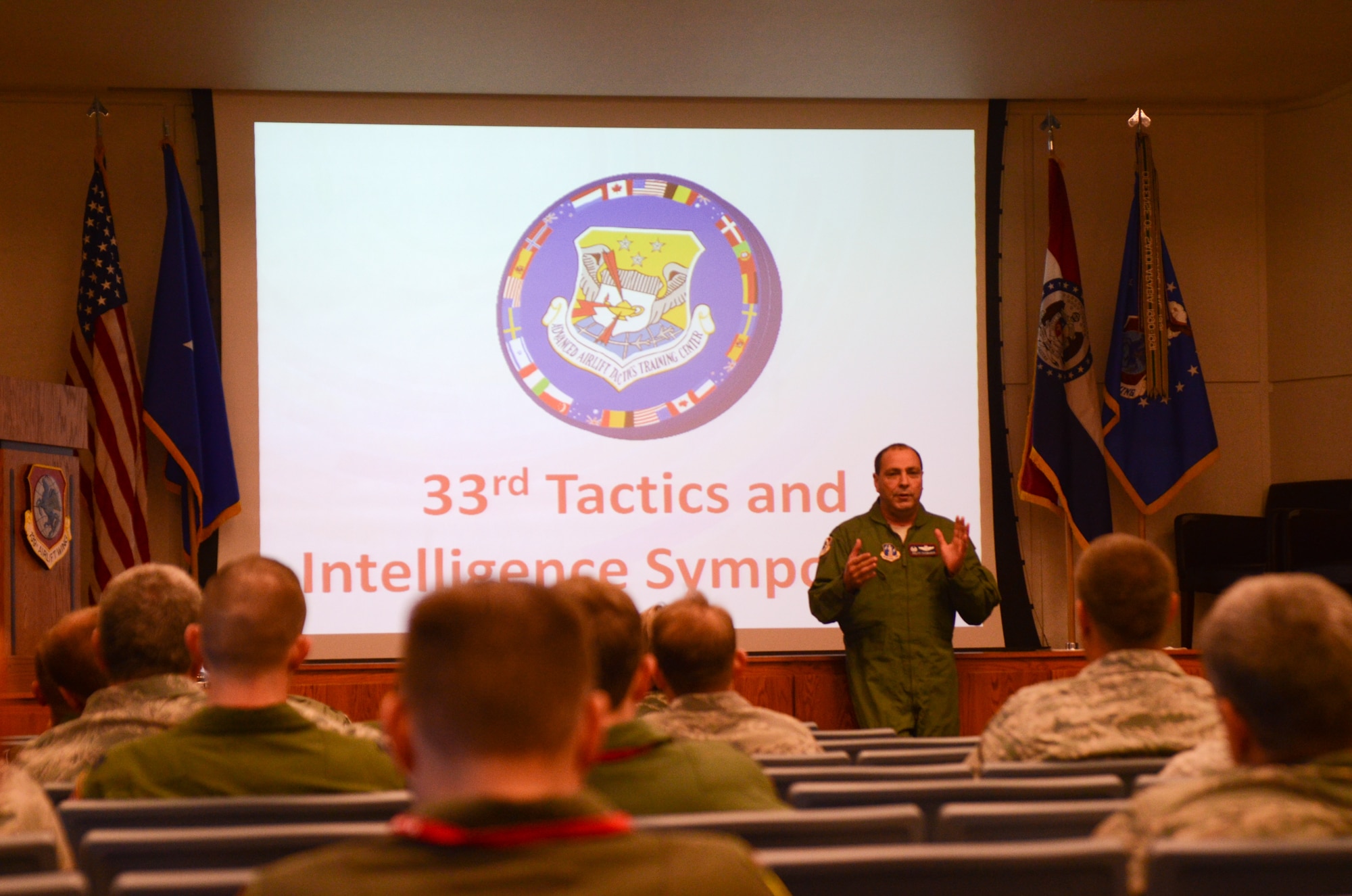 U.S. Air Force Col. Ralph Schwader, commander of the 139th Airlift Wing, Missouri Air National Guard, speaks during 33rd Annual Tactics and Intelligence Symposium Jan. 27, 2015 at Rosecrans Air National Guard Base, Mo. The Advanced Airlift Tactics Training Center hosts the symposium and the theme this year is international innovation and integration in mobility air forces. (U.S. Air National Guard photo by Tech. Sgt. Michael Crane/Released)