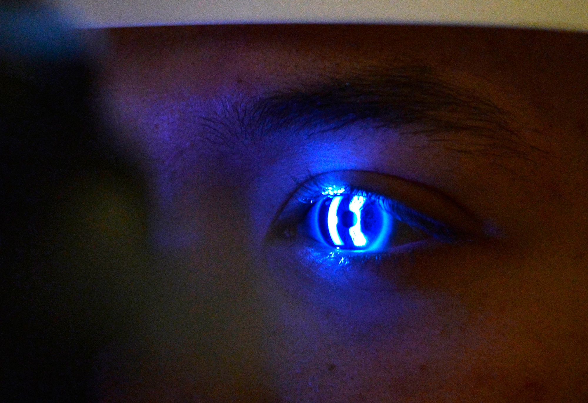Maj. Ivy Madson, 99th Air Base Squadron optometry flight commander, uses a Slit Lamp to examine the interior of the eye during an exam for Airman 1st Class Hunter, 18th Reconnaissance Squadron Airman, Jan. 13, 2015, at Creech Air Force Base, Nevada. The Creech Medical Aid Station now offers optometry services to all personnel assigned to Creech AFB Tuesdays from 7:30 a.m. to 3 p.m. (Last names have been withheld for security purposes). (U.S. Air Force photo by Staff Sgt. Adawn Kelsey/Released)