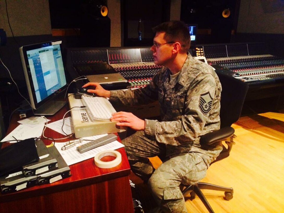 Master Sergeant Jim DeVaughn, one of the Band's sound engineers, works diligently
in our recording booth.  Recent projects include chamber ensemble recording,
the electronic ensemble guide, and preparation for the Band's Fourth of July
appearance in New York City. (U.S. Air Force Photo/released)
