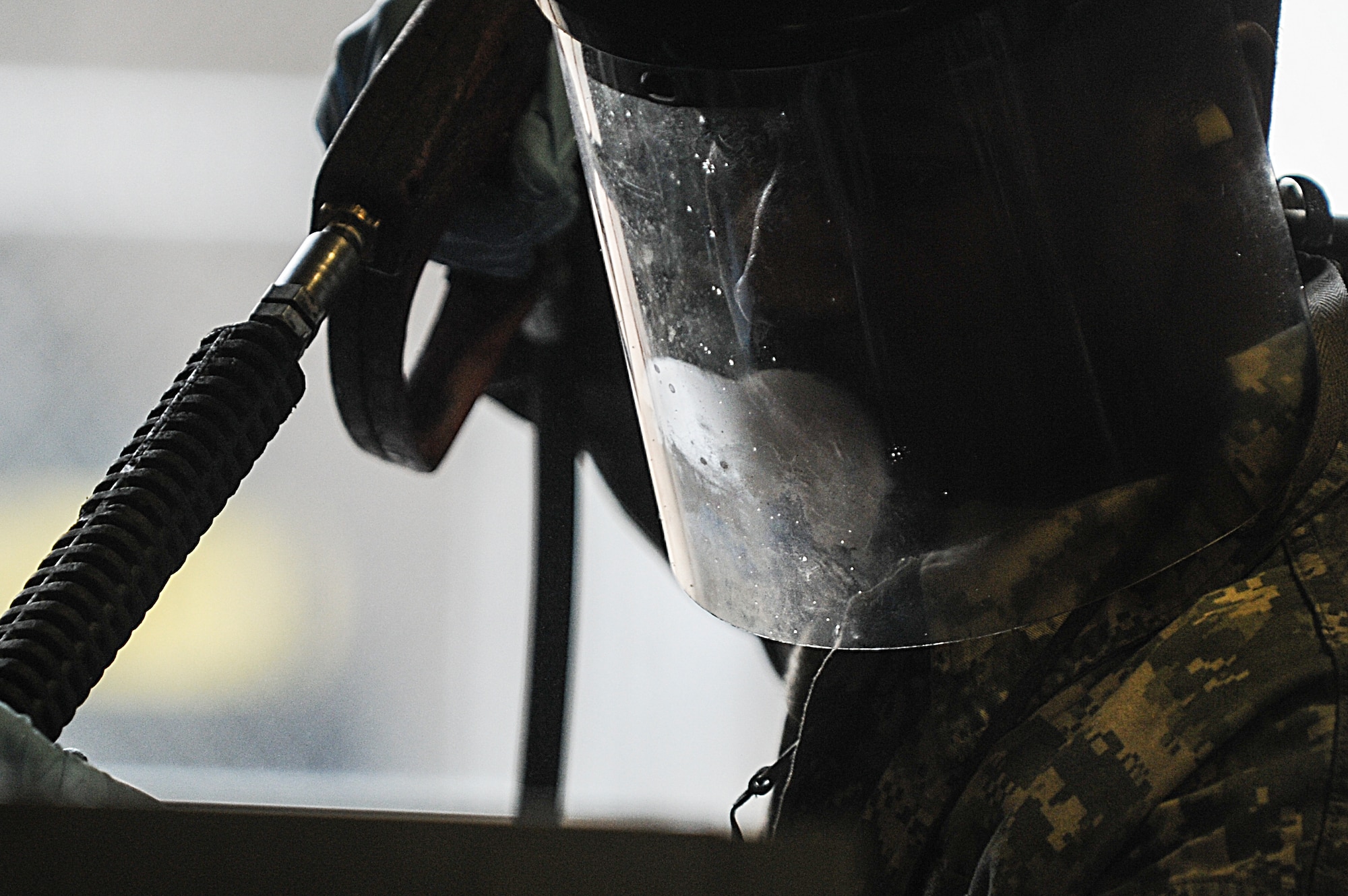Staff Sgt. Jarrett Williams, a 19th Maintenance Squadron aerospace ground equipment craftsman, uses a pressure washer to rinse off a ground heater Jan. 9, 2015, at Little Rock Air Force Base, Ark. Ground heaters are used to pre-heat the cabins and engines of aircraft during cold weather. (U.S. Air Force photo by Senior Airman Cliffton Dolezal)