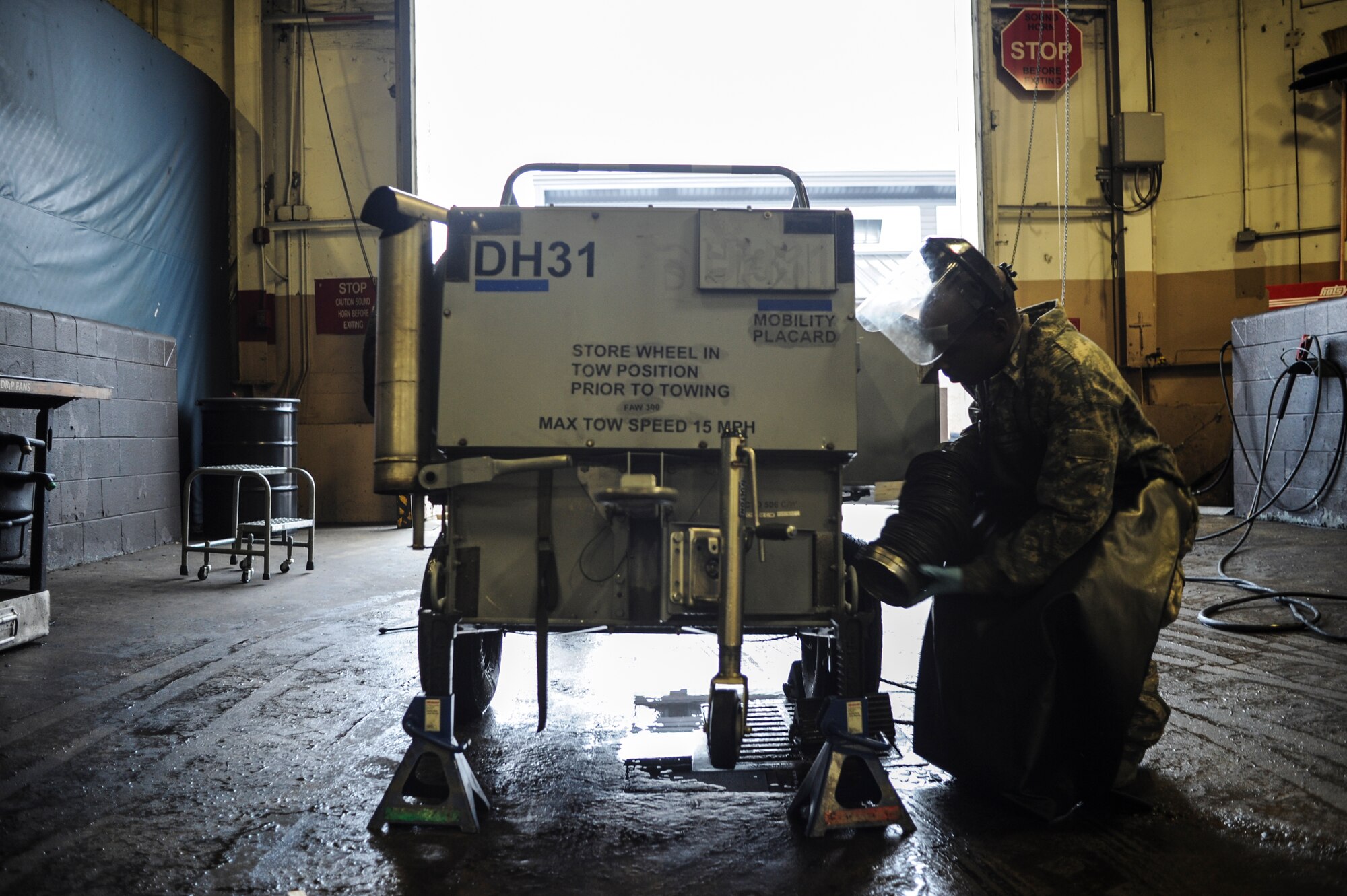Staff Sgt. Jarrett Williams, a 19th Maintenance Squadron aerospace ground equipment craftsman, prepares a ground heater to be washed after an inspection Jan. 9, 2015, at Little Rock Air Force Base, Ark. AGE inspects hundreds of pieces of equipment that are essential to ensuring an aircraft’s mission readiness. (U.S. Air Force photo by Senior Airman Cliffton Dolezal)