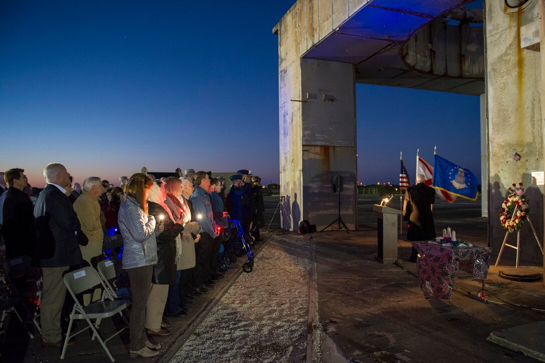 Members of the audience honor three former space pioneers at the 48th annual Apollo 1 Memorial Ceremony Jan. 27, 2015 at Launch Complex 34, Cape Canaveral Air Force Station. (U.S. Air Force photo/Matthew Jurgens)
