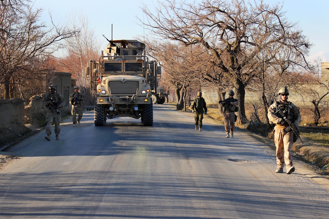 U.S., Czech and Afghan army soldiers patrol through a village in Parwan province, Afghanistan, Jan. 27, 2015. The soldiers are assigned to the 2nd Squadron, 3rd Cavalry Regiment.