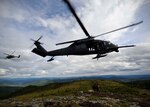 Two U.S. Air Force HH-60 Black Hawk helicopters from the 210th Rescue Squadron, Eielson Air Force Base, Alaska, arrive to rescue a simulated downed pilot during RED FLAG-Alaska 13-3, Aug. 22, 2013.   A similar craft rescued a pilot on Jan. 29, 2015.