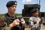 Staff Sgt. Josh Hartzell and Senior Airman Vanessa Garcia, both of the 165th Security Forces Squadron of the Georgia Air National Guard, provide perimeter security for the Avengers during Exercise Ardent Sentry 2010 in Savannah, Ga. The Avenger plays an instrumental part during the four-day exercise to demonstrate air defense capabilities.