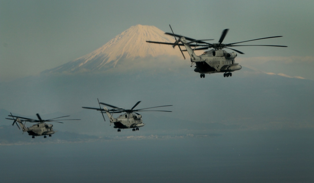 Three CH-53E Super Stallion Helicopters fly past Mount Fuji Jan. 24, during a two-day flight to Misawa Air Base, Japan, from Okinawa in support of Exercise Forest Light 15-2. Forest Light is a routine, semiannual exercise to strengthen U.S. and Japan military relations. The CH-53E helicopters are with Marine Heavy Helicopter Squadron 465, Marine Aircraft Group 16, currently assigned to Marine Aircraft Group 36, 1st Marine Aircraft Wing, III Marine Expeditionary Force, under the unit deployment program. 